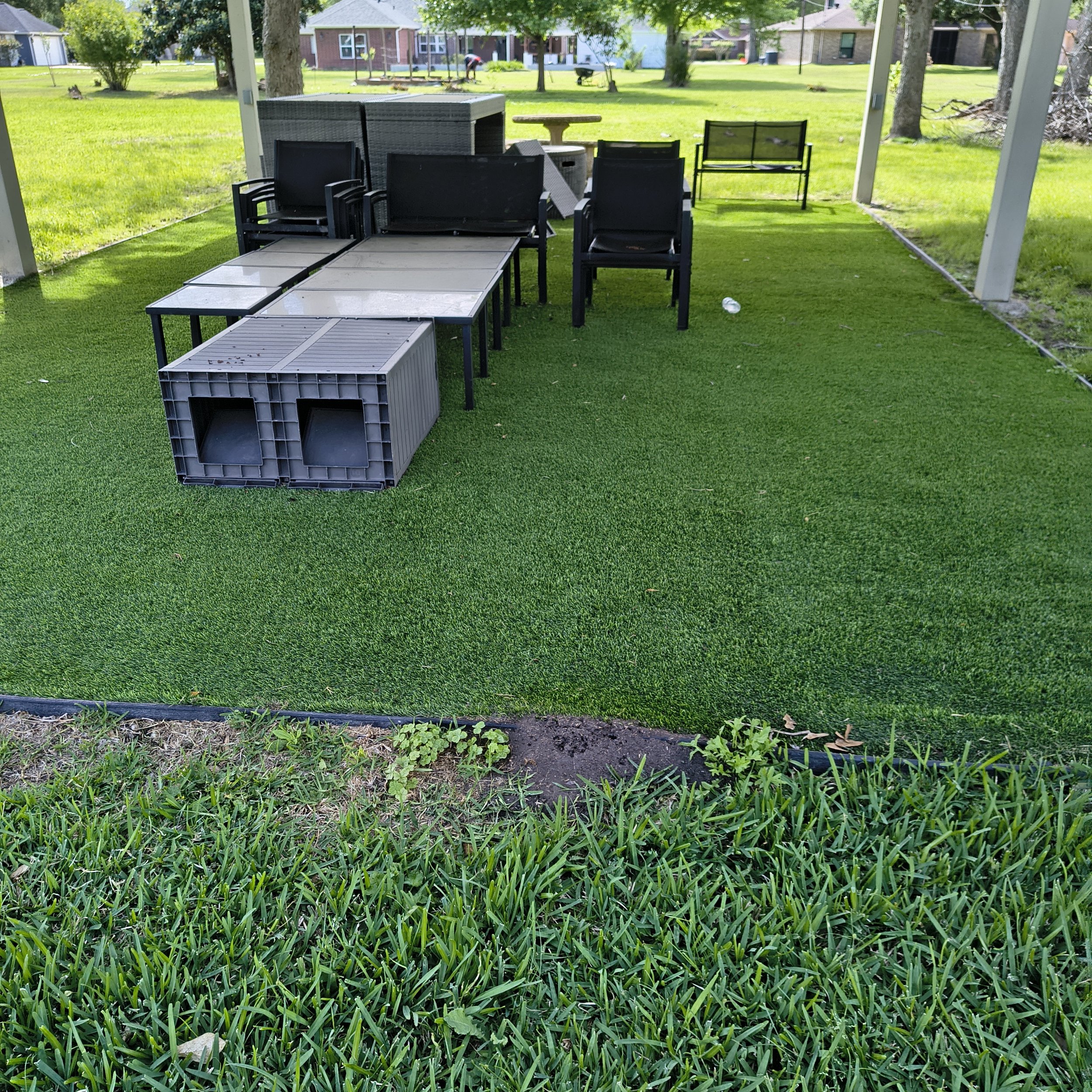 Cluttered backyard patio showing areas where pests may hide.