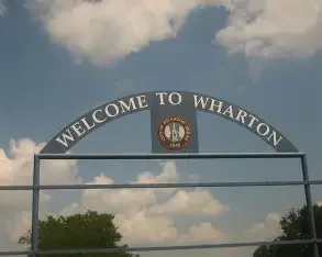 Welcome to Wharton sign, representing extended service area.