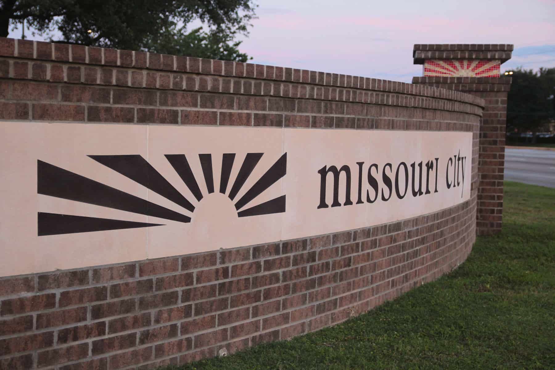 Missouri City brick welcome sign, representing local service coverage.
