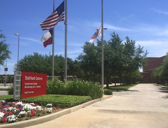 Stafford Centre sign with flags, representing local service coverage.