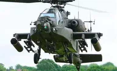 Military helicopter flying in the sky, emphasizing veteran‑owned company branding.